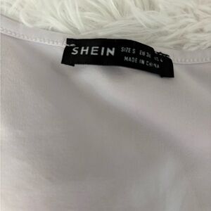 Black and white going out top